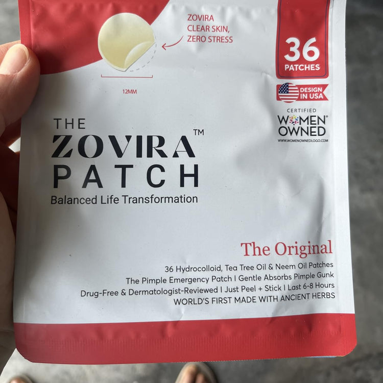 Zovira Patch packaging held by a person, showing details of the product and branding.