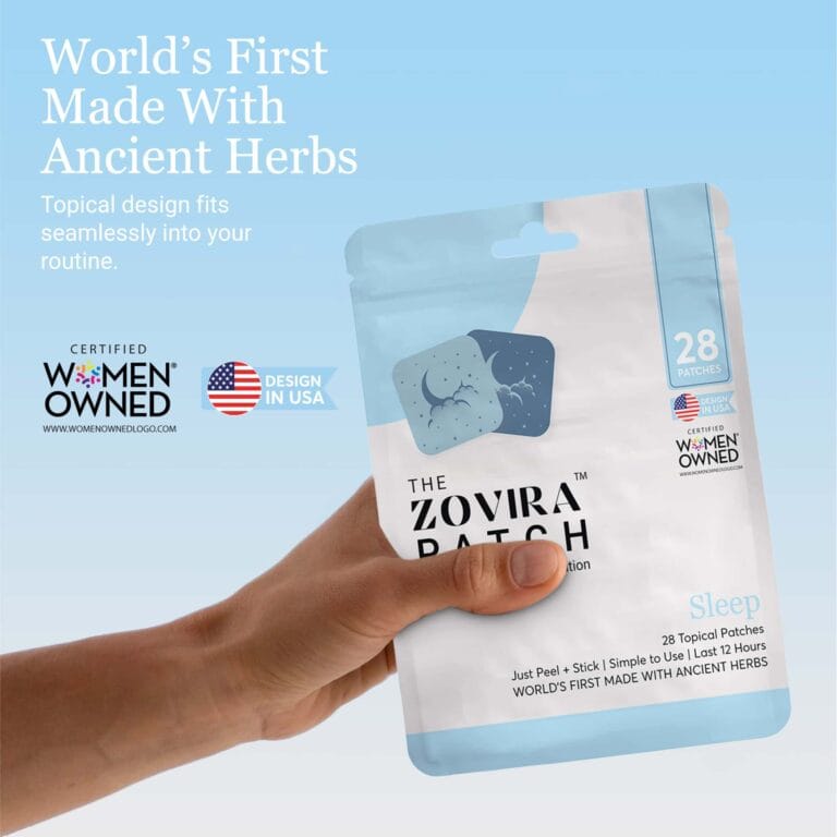 Hand holding Zovira Patch with extra blue, world's first made with ancient herbs, certified women-owned, made in USA.